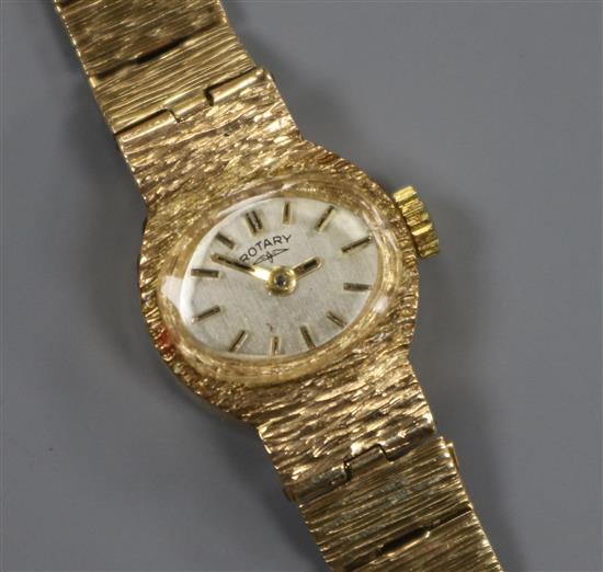 A ladys textured 9ct gold Rotary manual wind wrist watch.